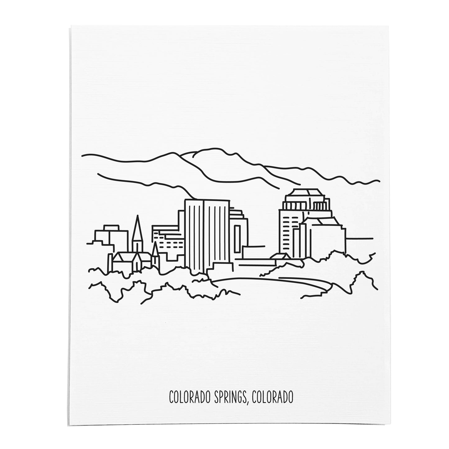 An art print featuring a line drawing of the Colorado Springs Skyline on white linen paper