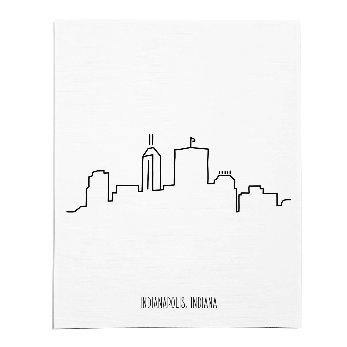 An art print featuring a line drawing of the Indianapolis Skyline on white linen paper