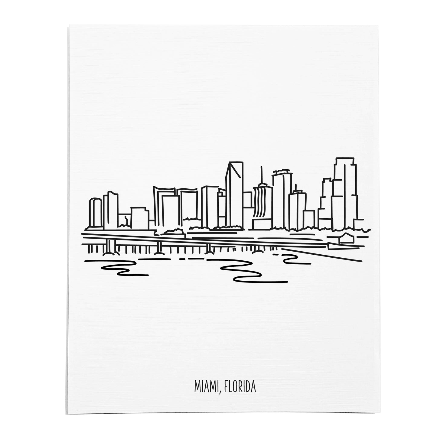 An art print featuring a line drawing of the Miami Skyline on white linen paper