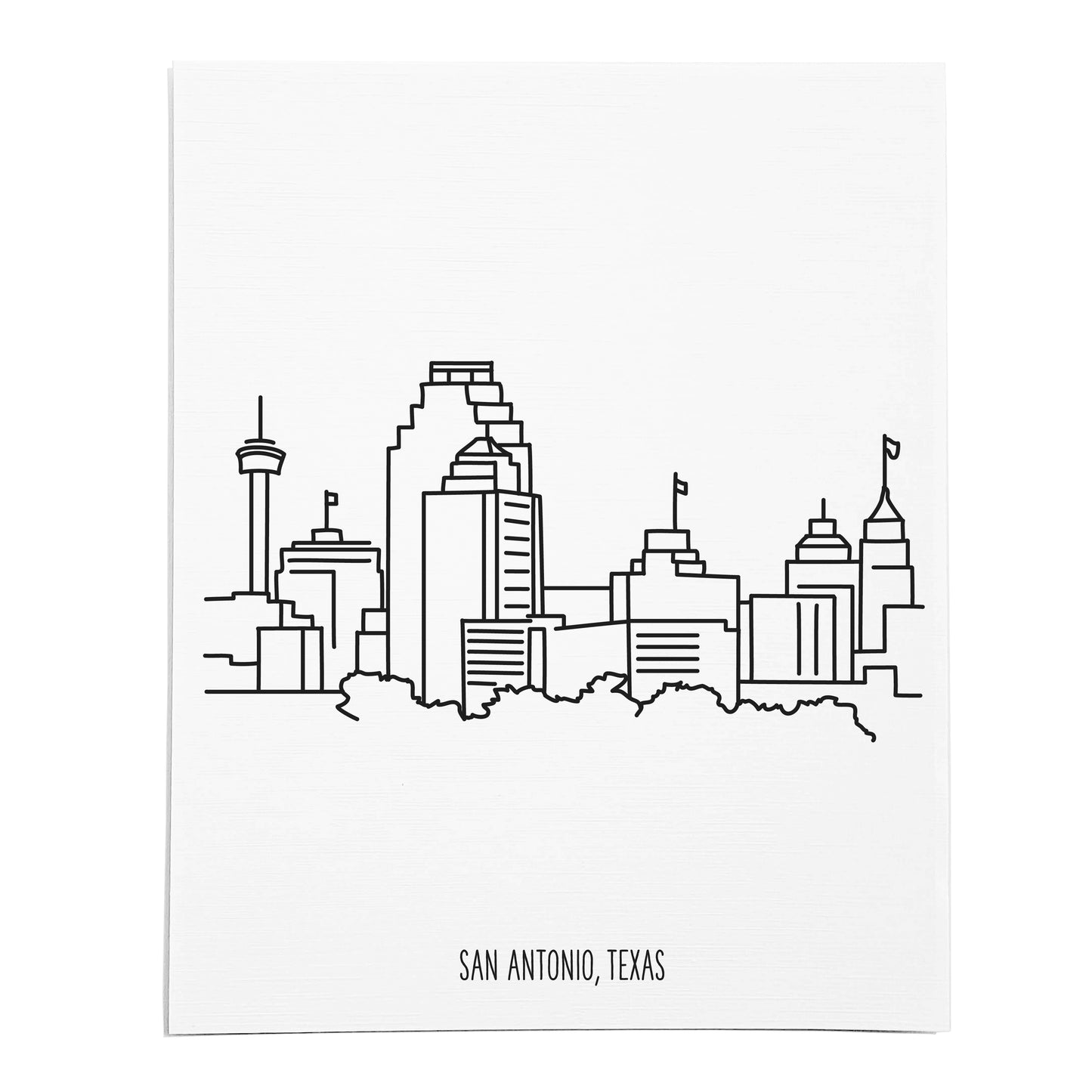 An art print featuring a line drawing of the San Antonio Skyline on white linen paper