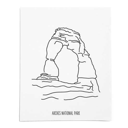 An art print featuring a line drawing of Arches National Park on white linen paper
