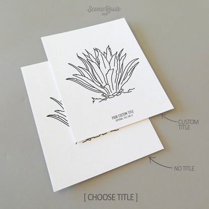 Two line art drawings of an Agave plant on white linen paper with a gray background.  The pieces are shown with “No Title” and “Custom Title” options for the available art print options.