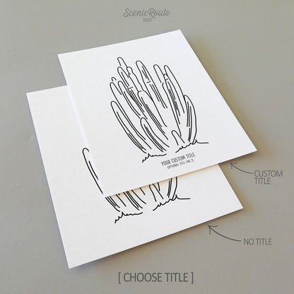Two line art drawings of an Organ Pipe Cactus on white linen paper with a gray background.  The pieces are shown with “No Title” and “Custom Title” options for the available art print options.