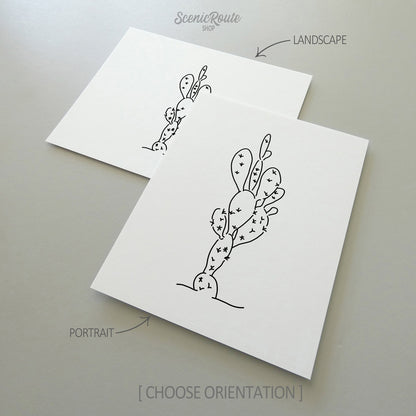 Two line art drawings of a Prickly Pear Cactus on white linen paper with a gray background.  The pieces are shown in portrait and landscape orientation for the available art print options.