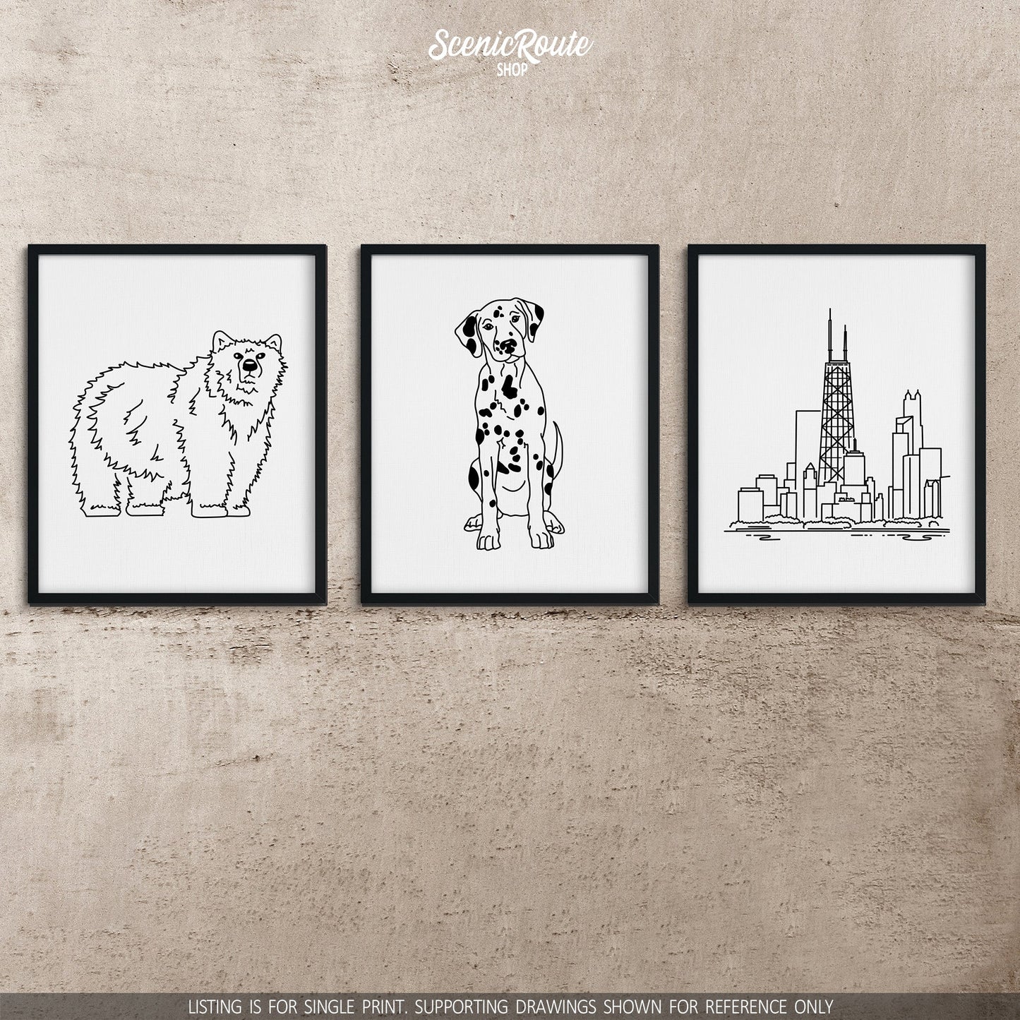 A group of three framed drawings on a concrete wall.  The line art drawings include a Grizzly Bear, a Dalmatian dog, and the John Hancock Tower in Chicago