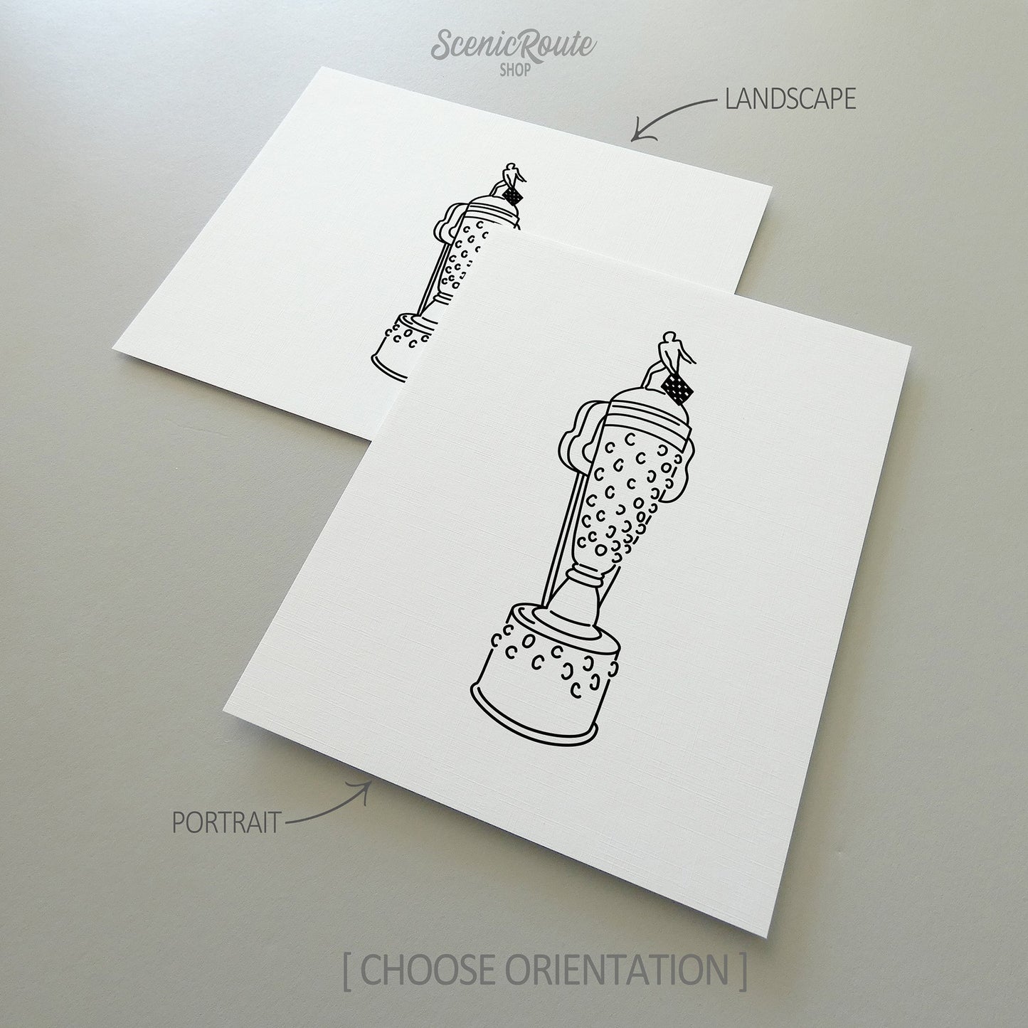 Two line art drawings of the Indy Car Borg Warner Trophy on white linen paper with a gray background. The pieces are shown in portrait and landscape orientation for the available art print options.