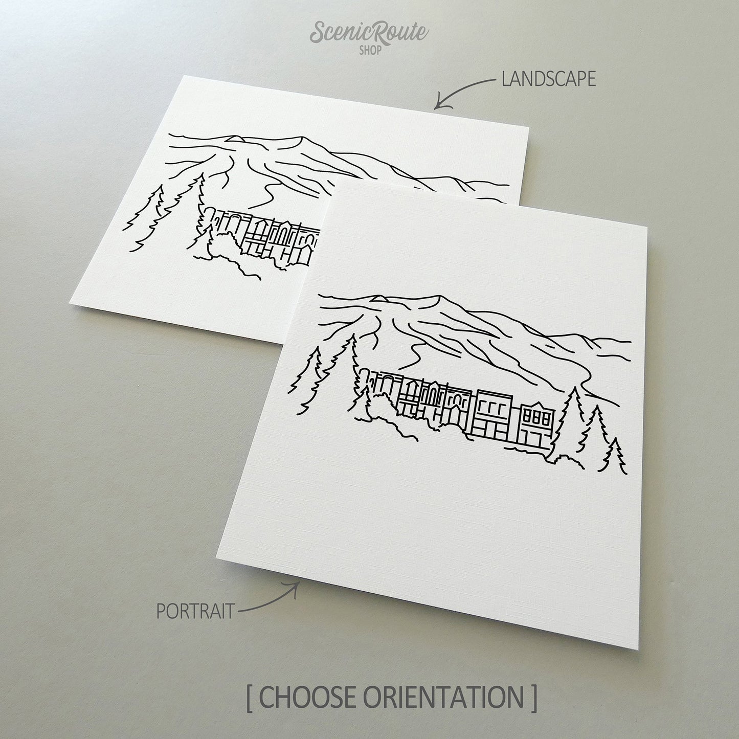 Two line art drawings of Breckenridge on white linen paper with a gray background.  The pieces are shown in portrait and landscape orientation for the available art print options.