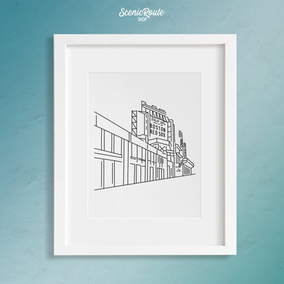 A framed line art drawing of Fenway Park on a blue wall