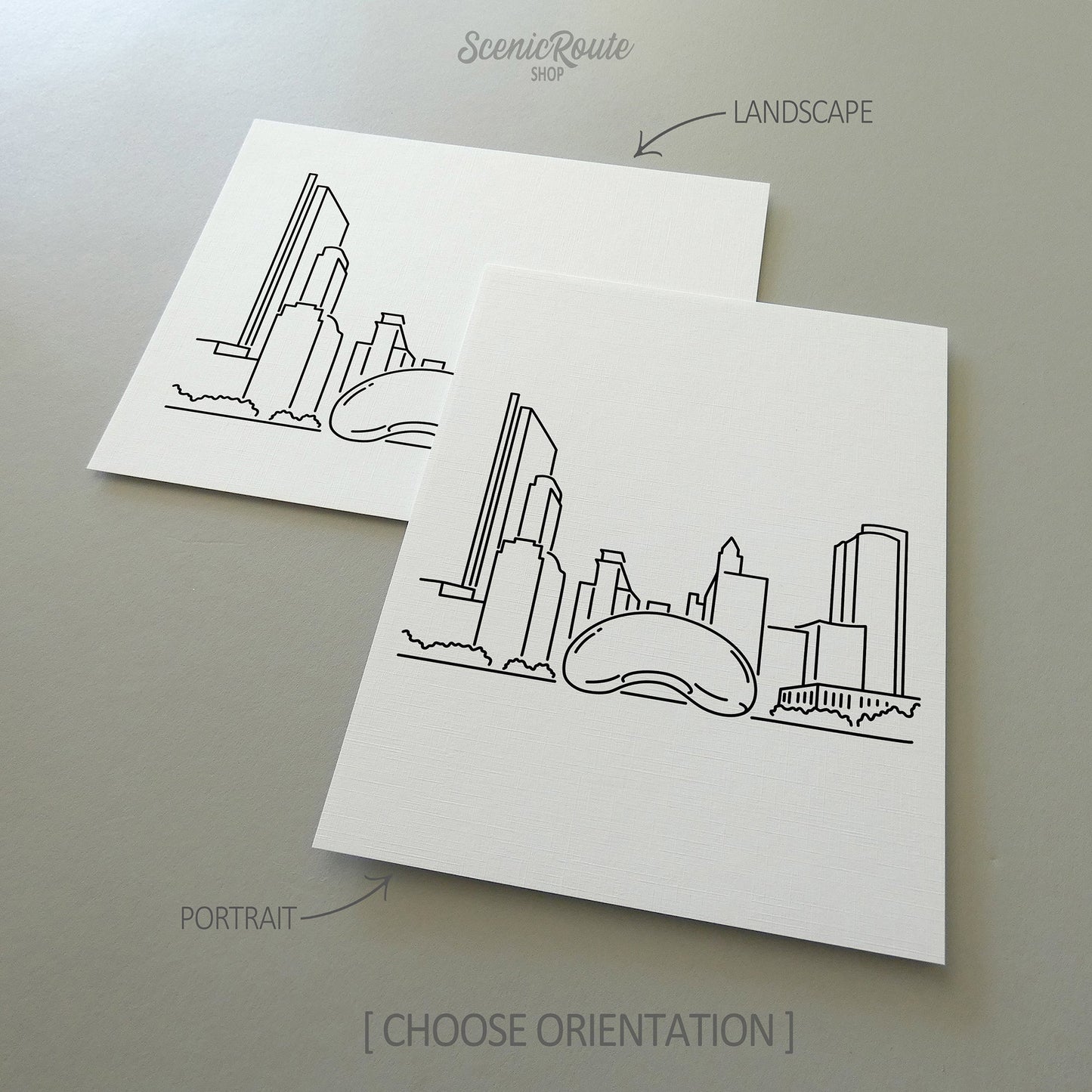 Two line art drawings of the Chicago Bean Sculpture on white linen paper with a gray background.  The pieces are shown in portrait and landscape orientation for the available art print options.
