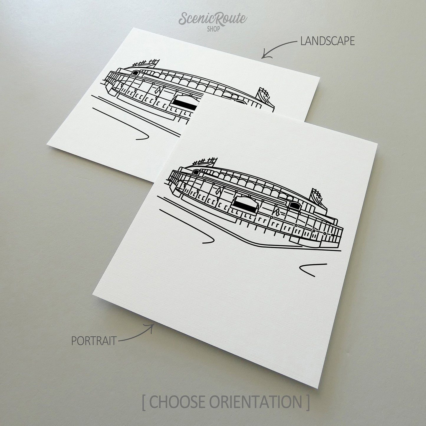 Two line art drawings of Wrigley Field on white linen paper with a gray background.  The pieces are shown in portrait and landscape orientation for the available art print options.