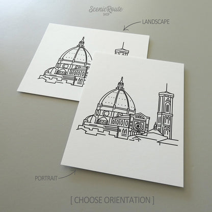 Two line art drawings of the Florence Duomo on white linen paper with a gray background.  The pieces are shown in portrait and landscape orientation for the available art print options.