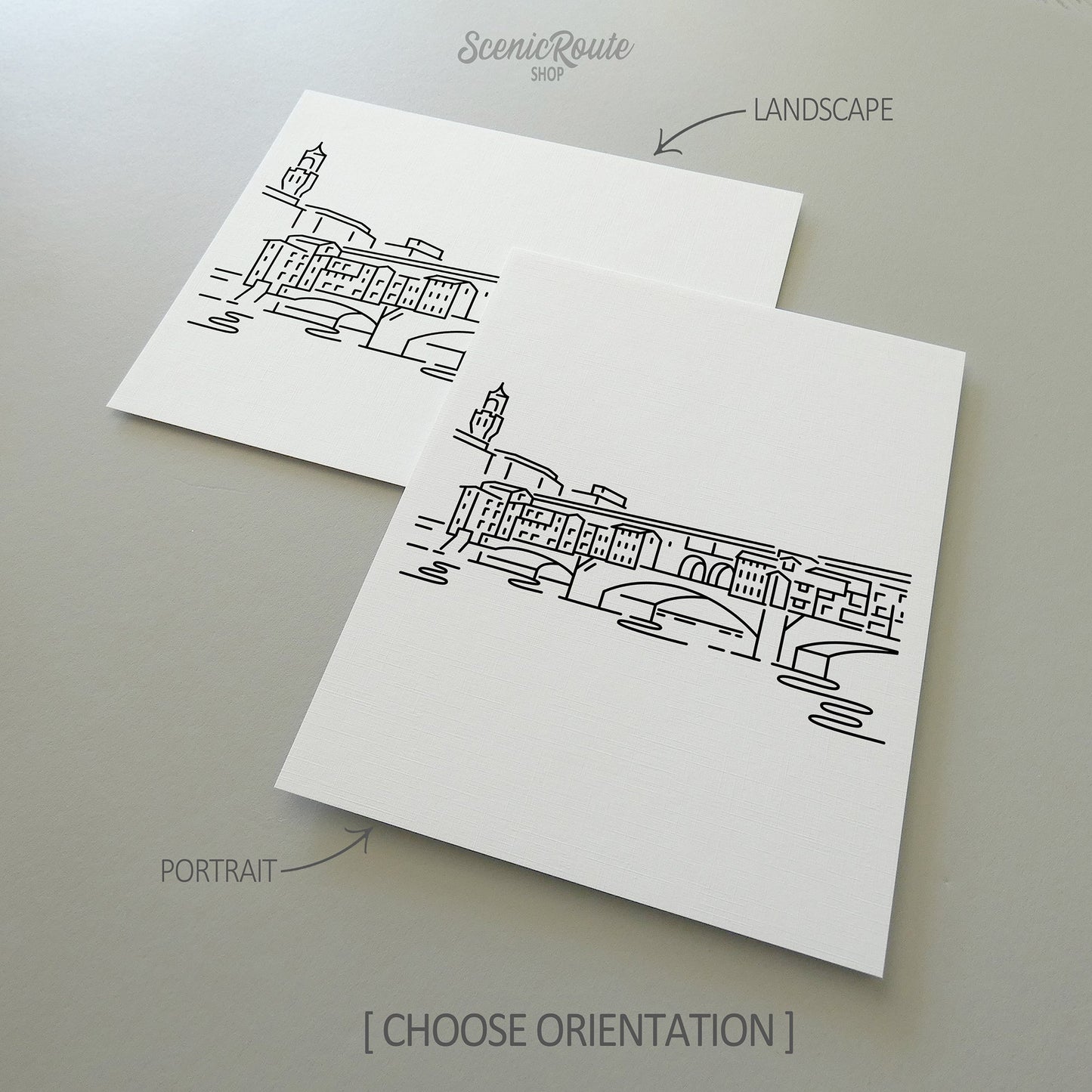 Two line art drawings of the Ponte Vecchio on white linen paper with a gray background.  The pieces are shown in portrait and landscape orientation for the available art print options.