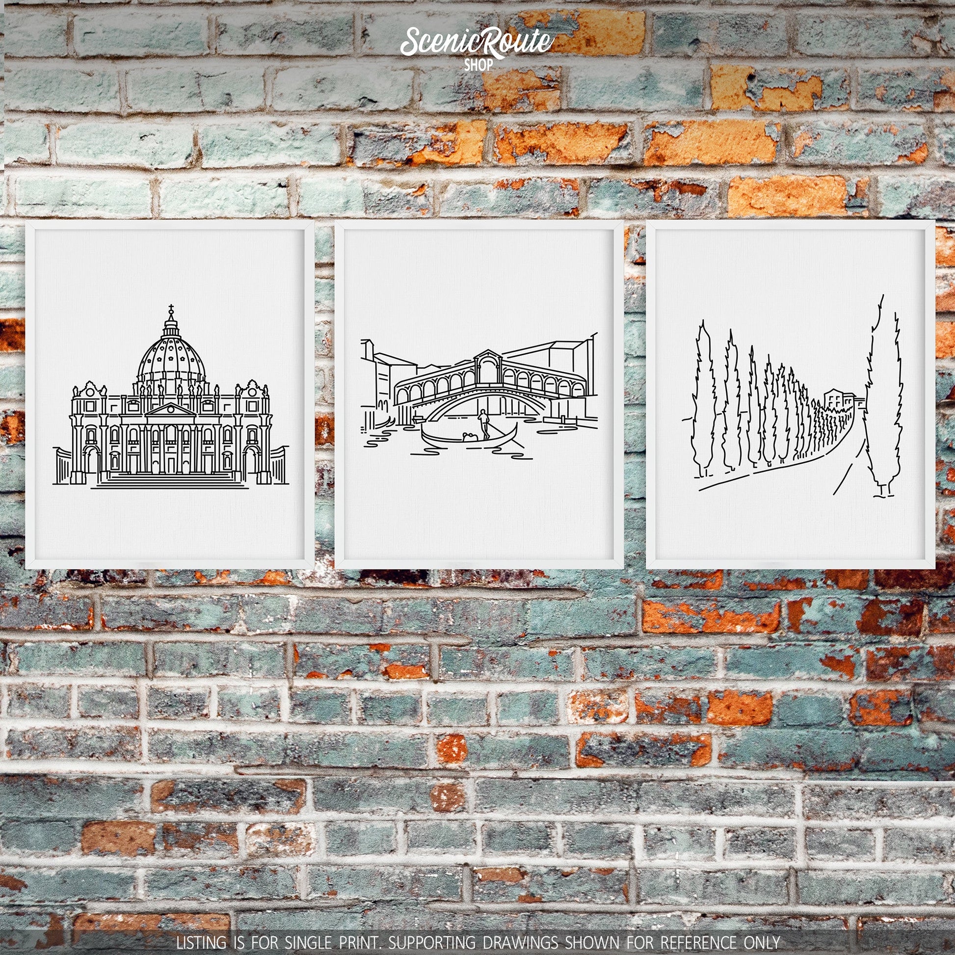 A group of three framed drawings on a brick wall. The line art drawings include Saint Peters Basilica, the Rialto Bridge, and a Tuscany Drive