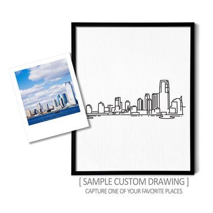 A custom line art drawing of a skyline on white linen paper in a thin black picture frame