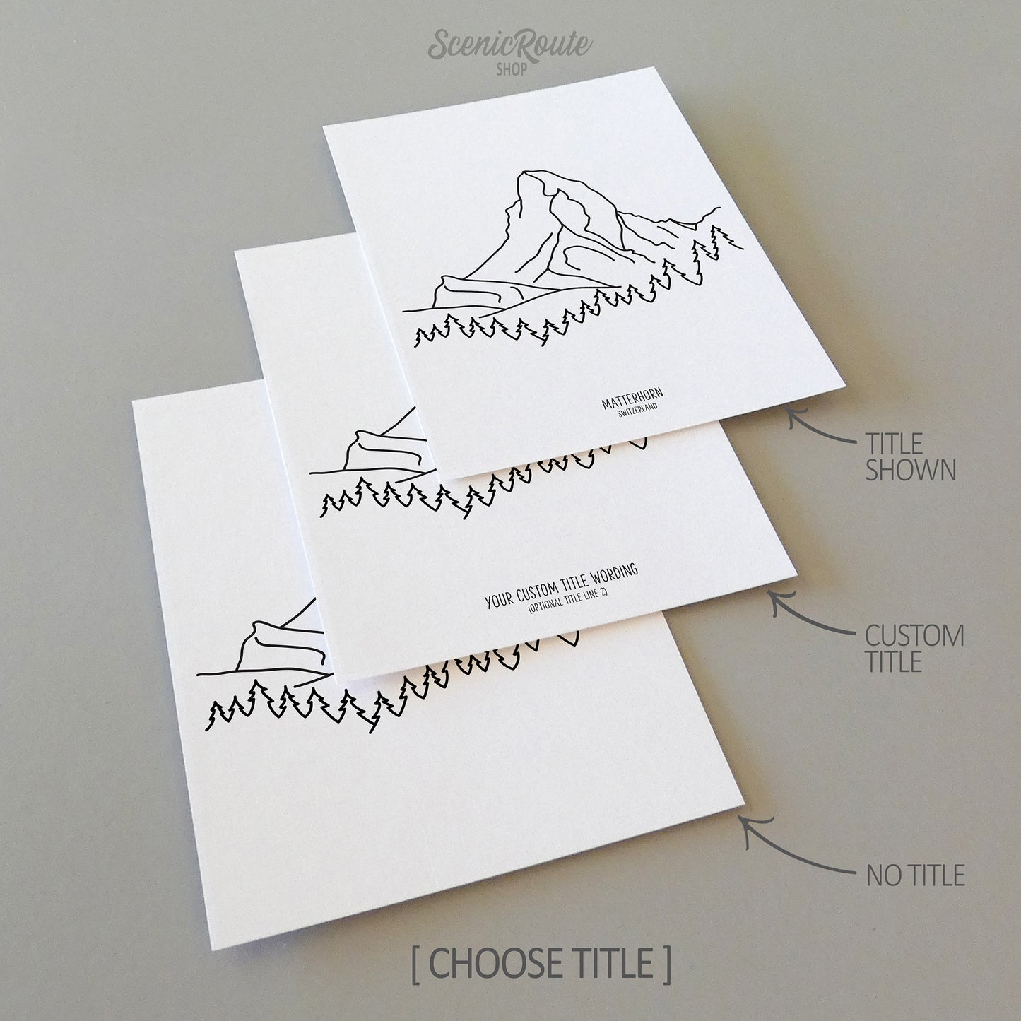 Three line art drawings of the Matterhorn Mountain in Switzerland on white linen paper with a gray background. The pieces are shown with title options that can be chosen and personalized.