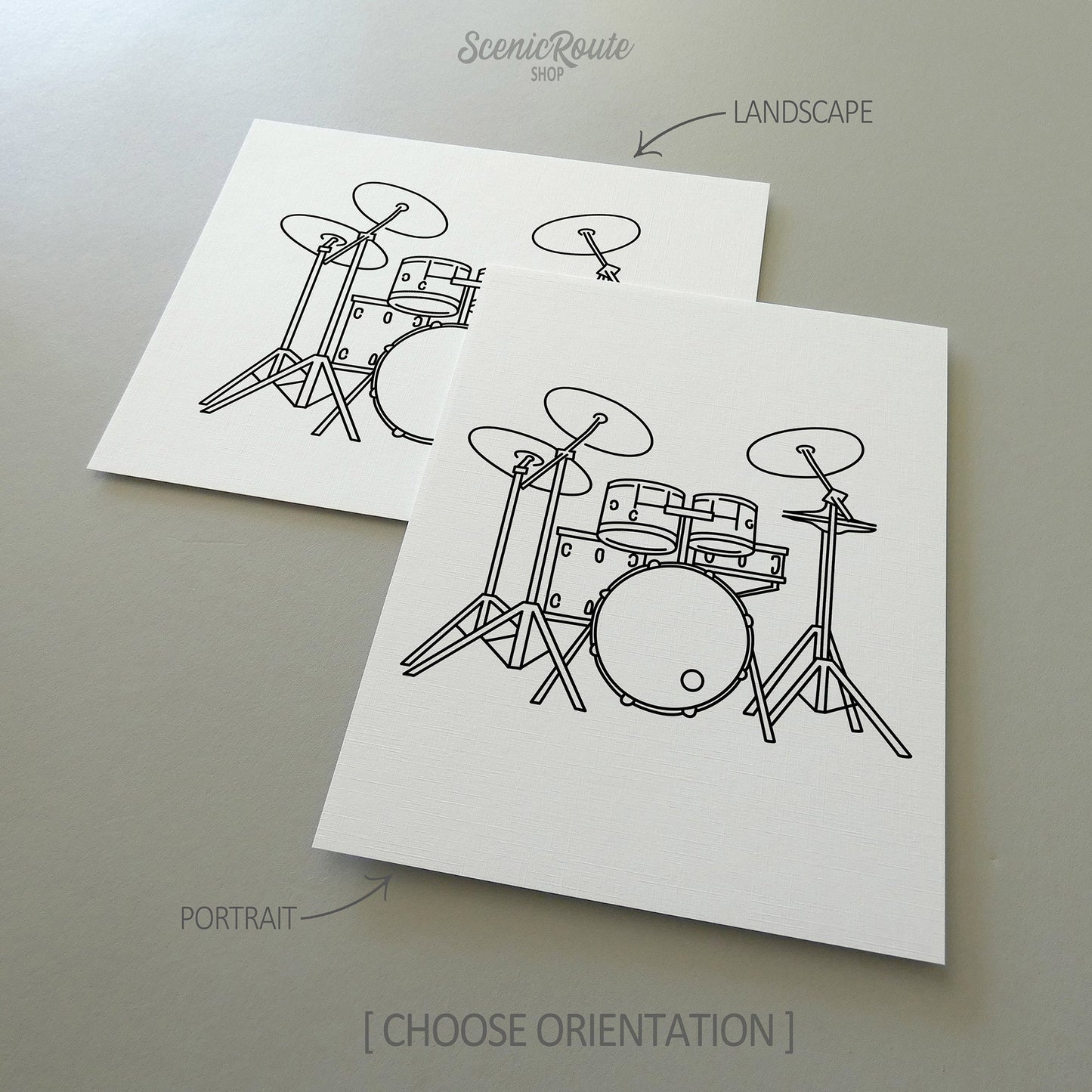 Two line art drawings of Drums on white linen paper with a gray background.  The pieces are shown in portrait and landscape orientation for the available art print options.
