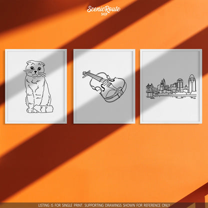 A group of three framed drawings on a orange wall with sun shadows. The line art drawings include a Scottish Fold cat, a Violin, and the Cincinnati Skyline