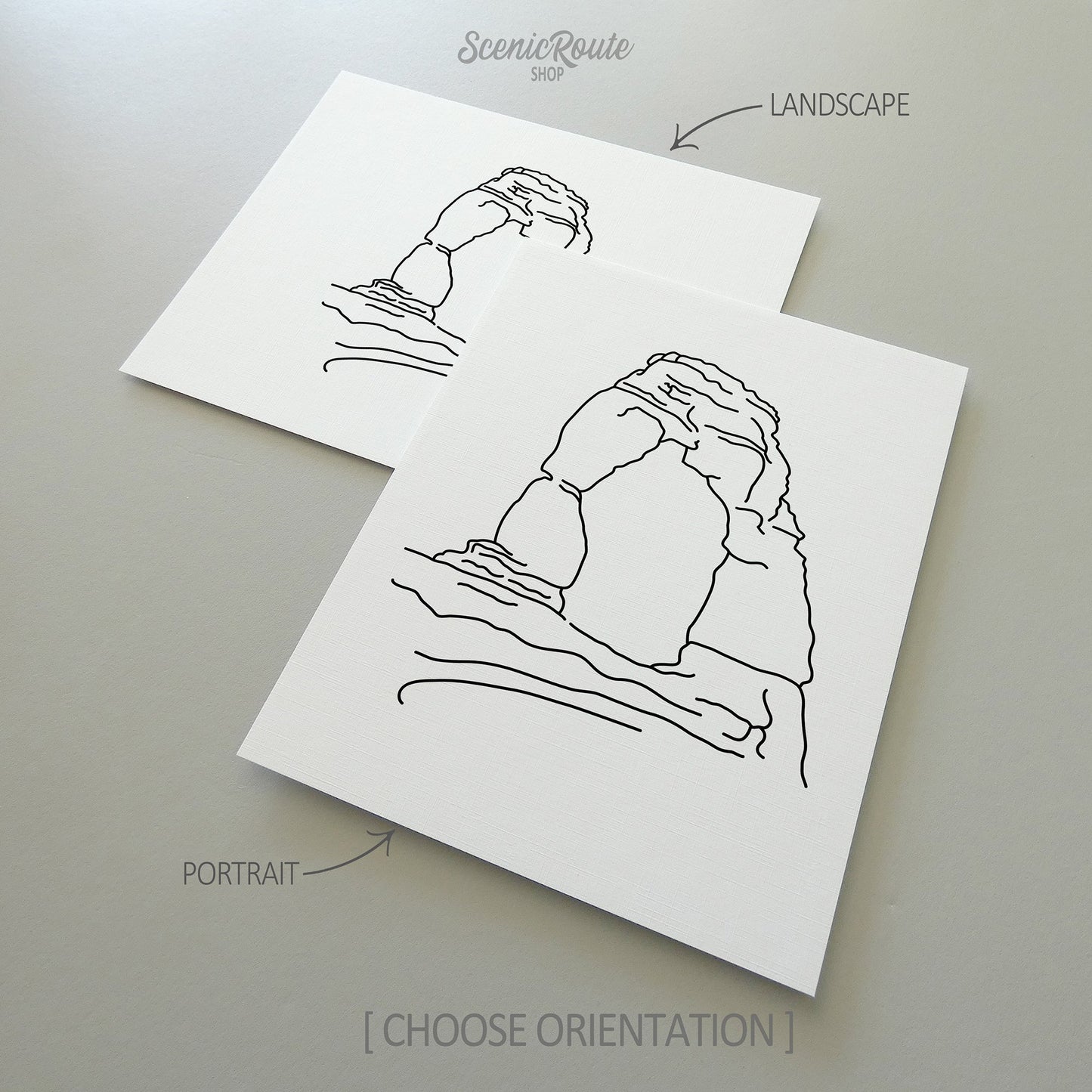 Two line art drawings of Arches National Park on white linen paper with a gray background. The pieces are shown in portrait and landscape orientation for the available art print options.