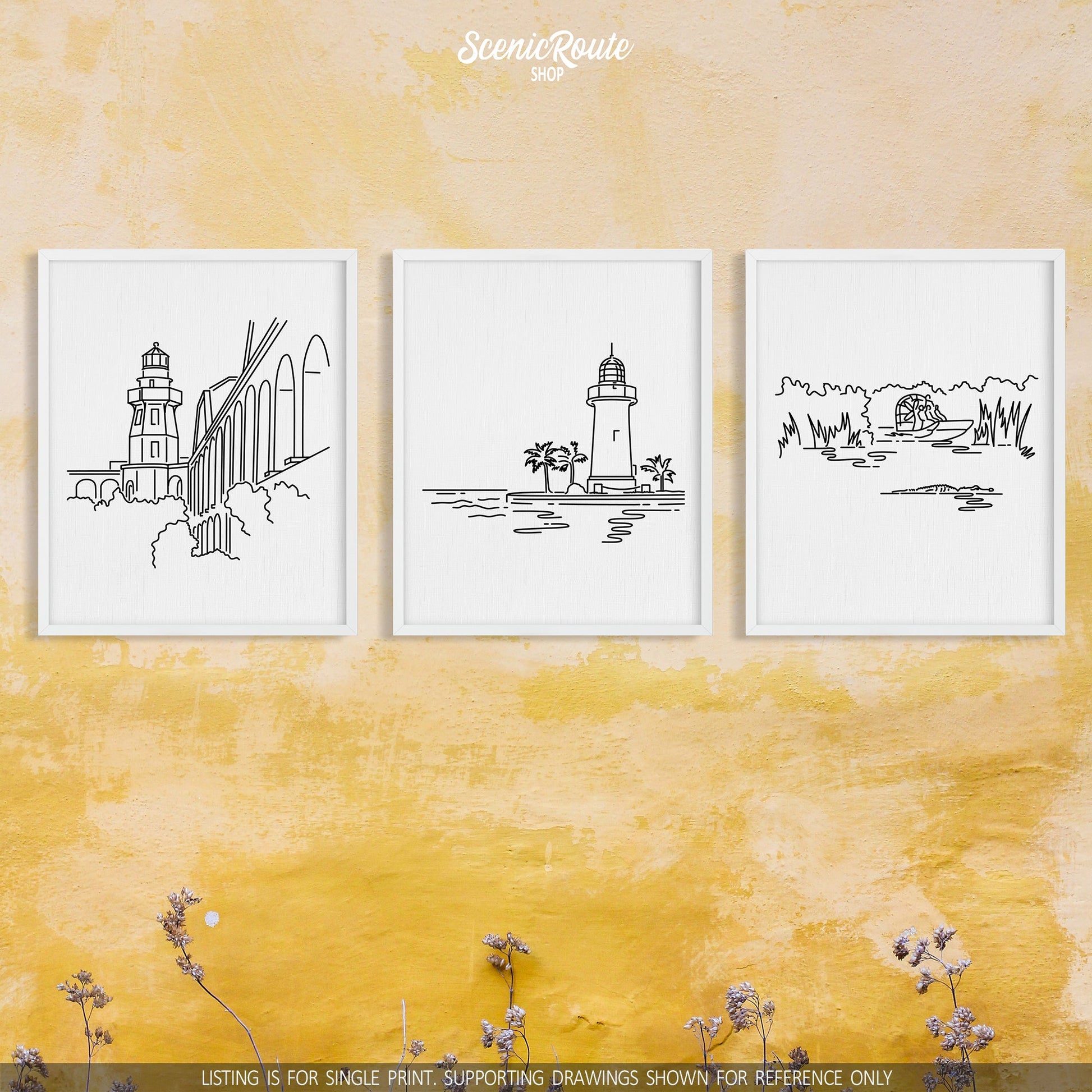 A group of three framed drawings on a yellow wall. The line art drawings include Dry Tortugas National Park, Biscayne National Park, and Everglades National Park