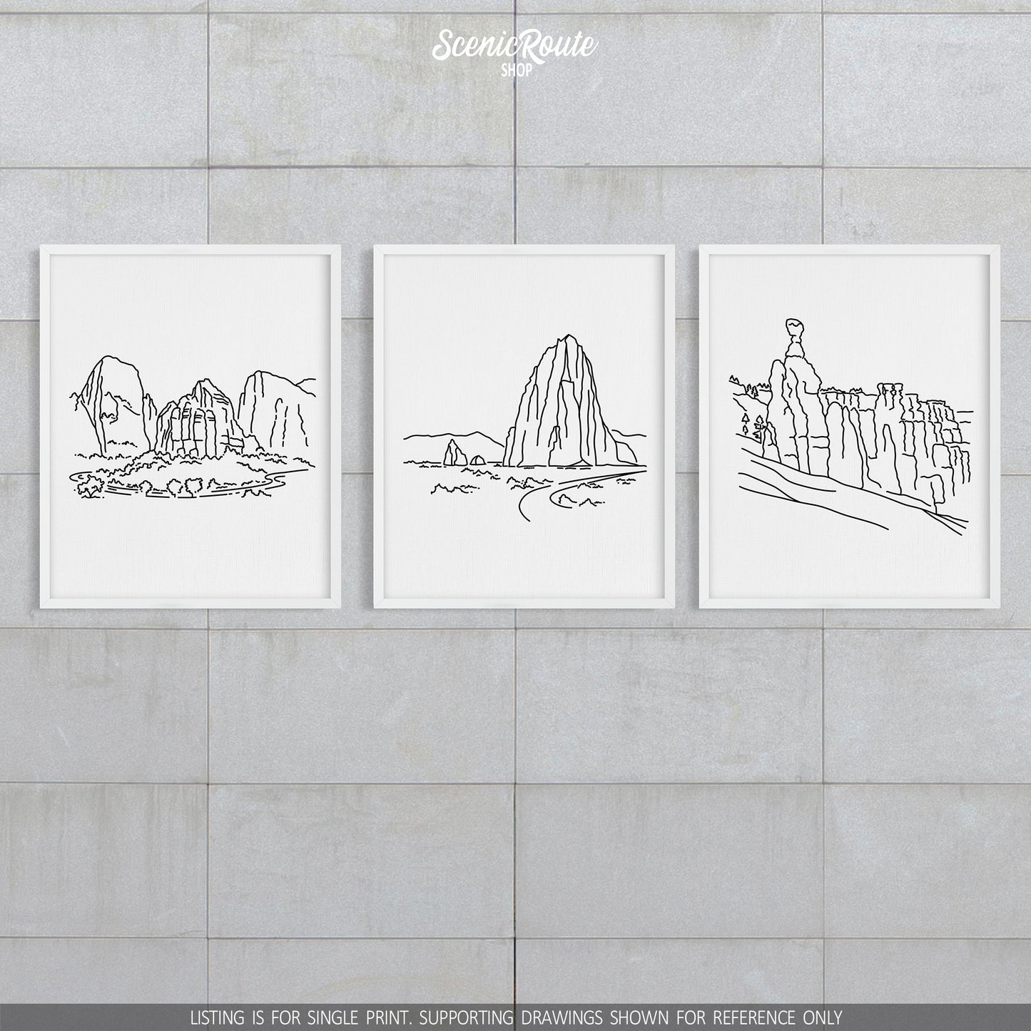 A group of three framed drawings on a block wall. The line art drawings include Zion National Park, Capitol Reef National Park, and Bryce Canyon National Park