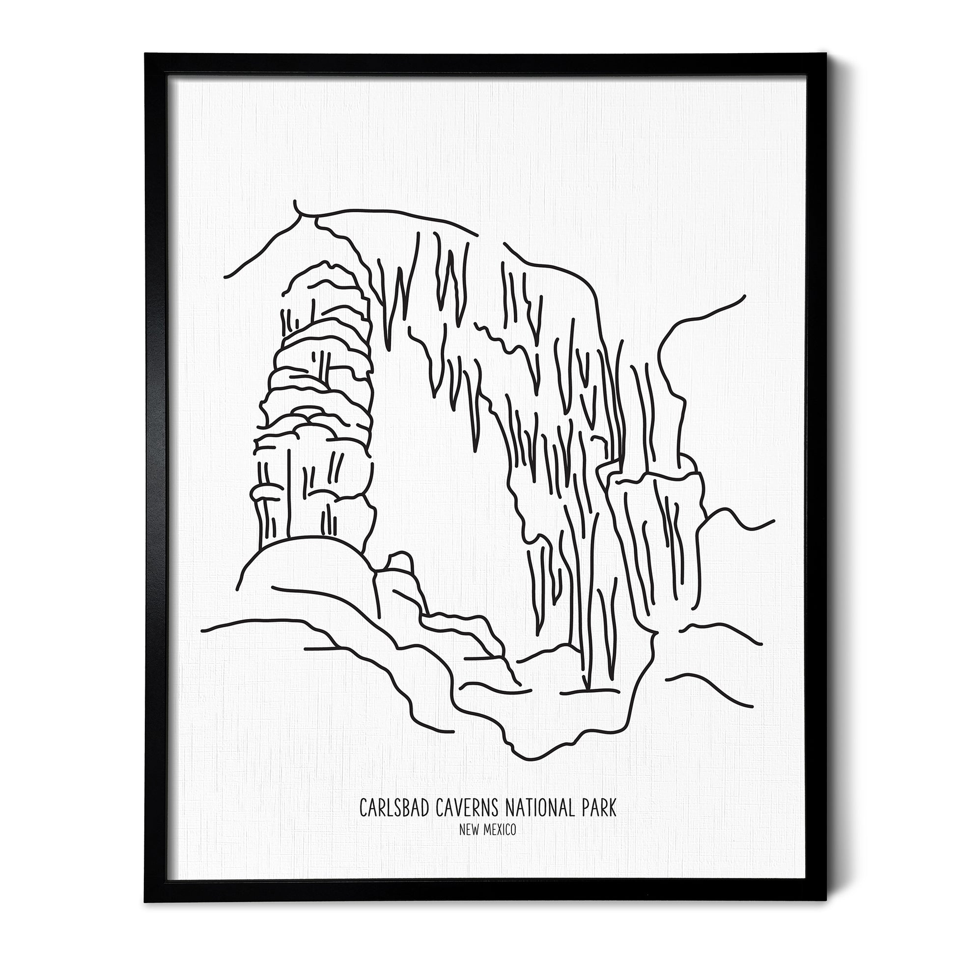 A line art drawing of Carlsbad Caverns National Park on white linen paper in a thin black picture frame