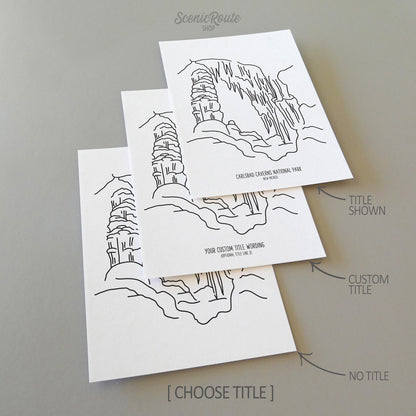 Three line art drawings of Carlsbad Caverns National Park on white linen paper with a gray background. The pieces are shown with title options that can be chosen and personalized.