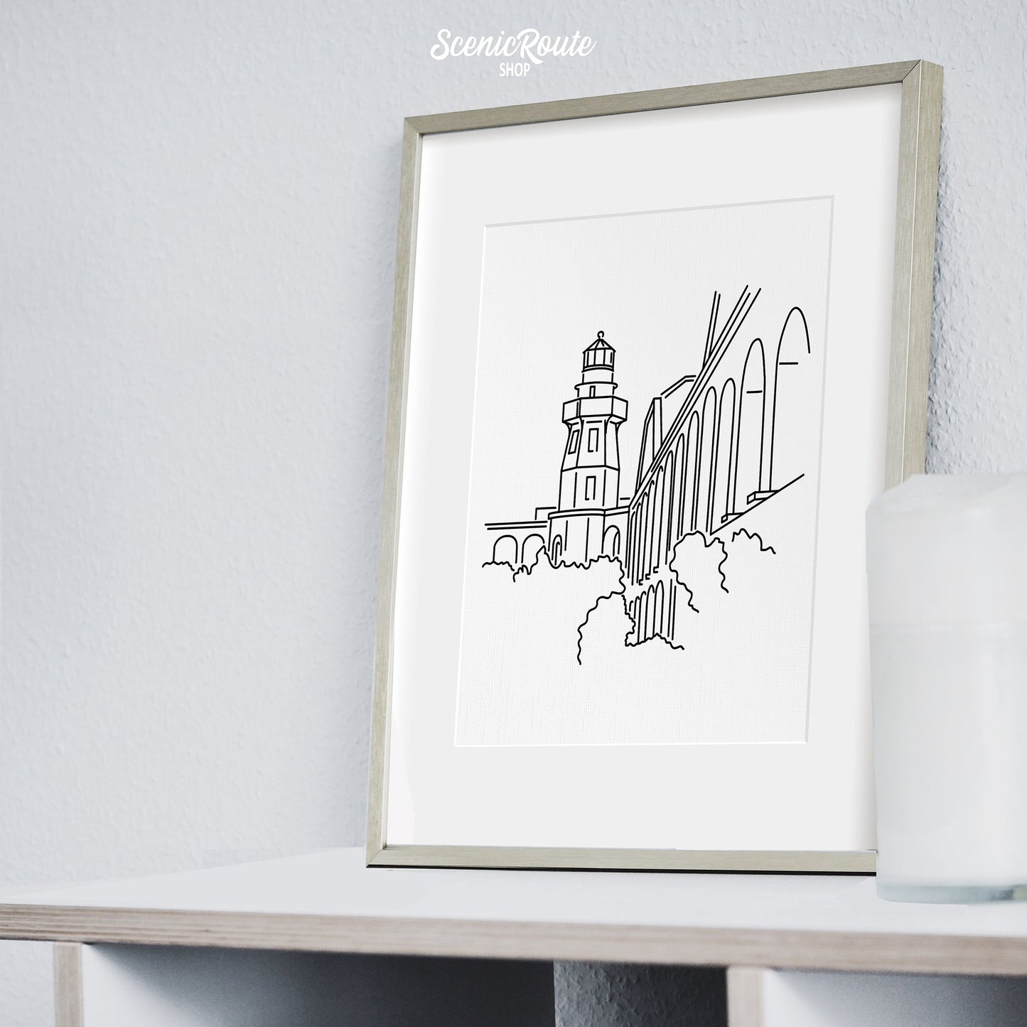 A framed line art drawing of Dry Tortugas National Park on a bookcase