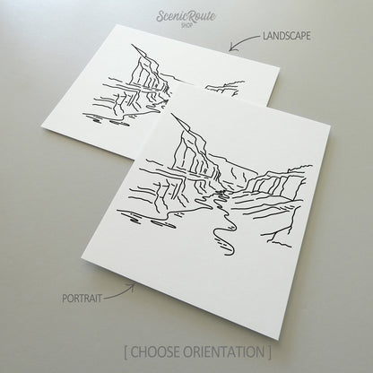 Two line art drawings of Grand Canyon National Park on white linen paper with a gray background.  The pieces are shown in portrait and landscape orientation for the available art print options.