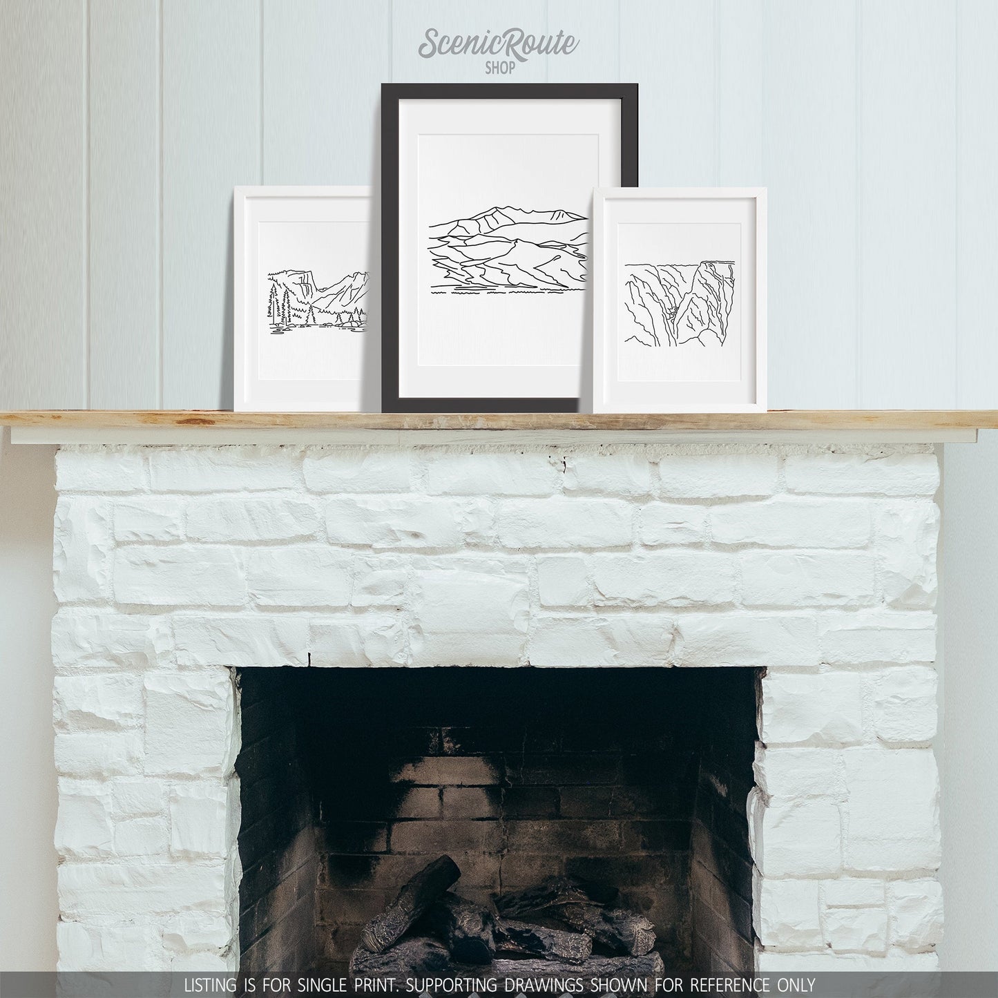 A group of three framed drawings on a fireplace mantle. The line art drawings include Rocky Mountain National Park, Great Sand Dunes National Park, and Black Canyon of the Gunnison National Park