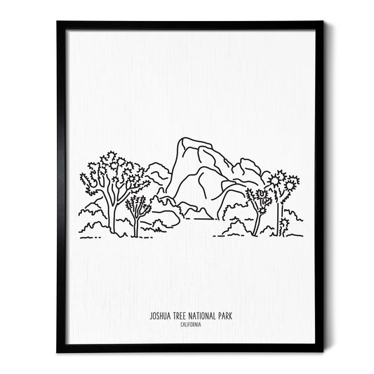 A line art drawing of Joshua Tree National Park on white linen paper in a thin black picture frame