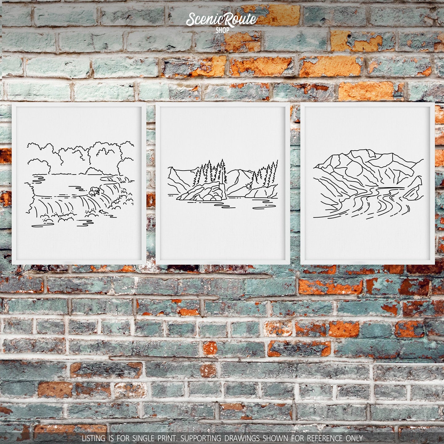 A group of three framed drawings on a brick wall. The line art drawings include Katmai National Park, Kenai Fjords National Park, and Wrangell Saint Elias National Park
