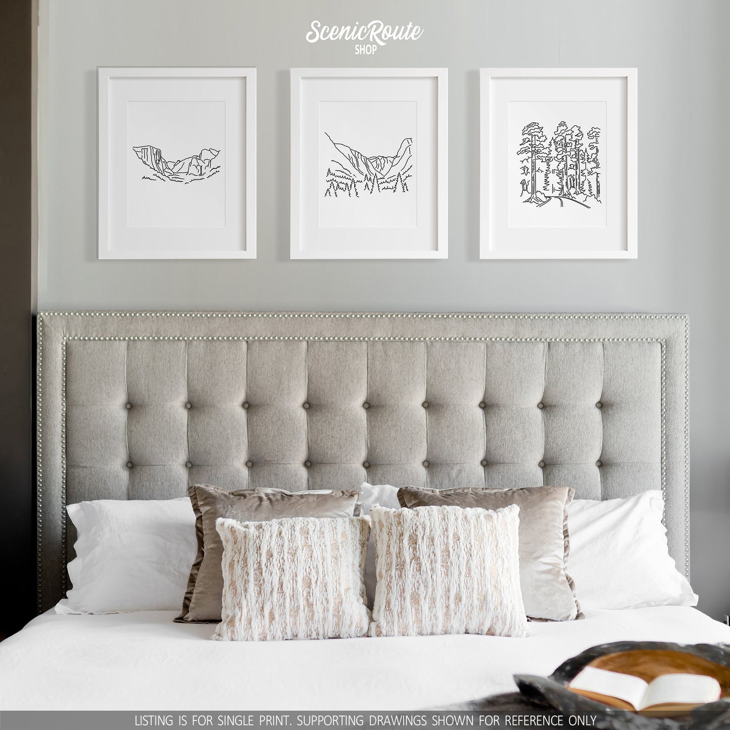 A group of three framed drawings on a white wall above a bed. The line art drawings include Yosemite National Park, Kings Canyon National Park, and Redwood National Park