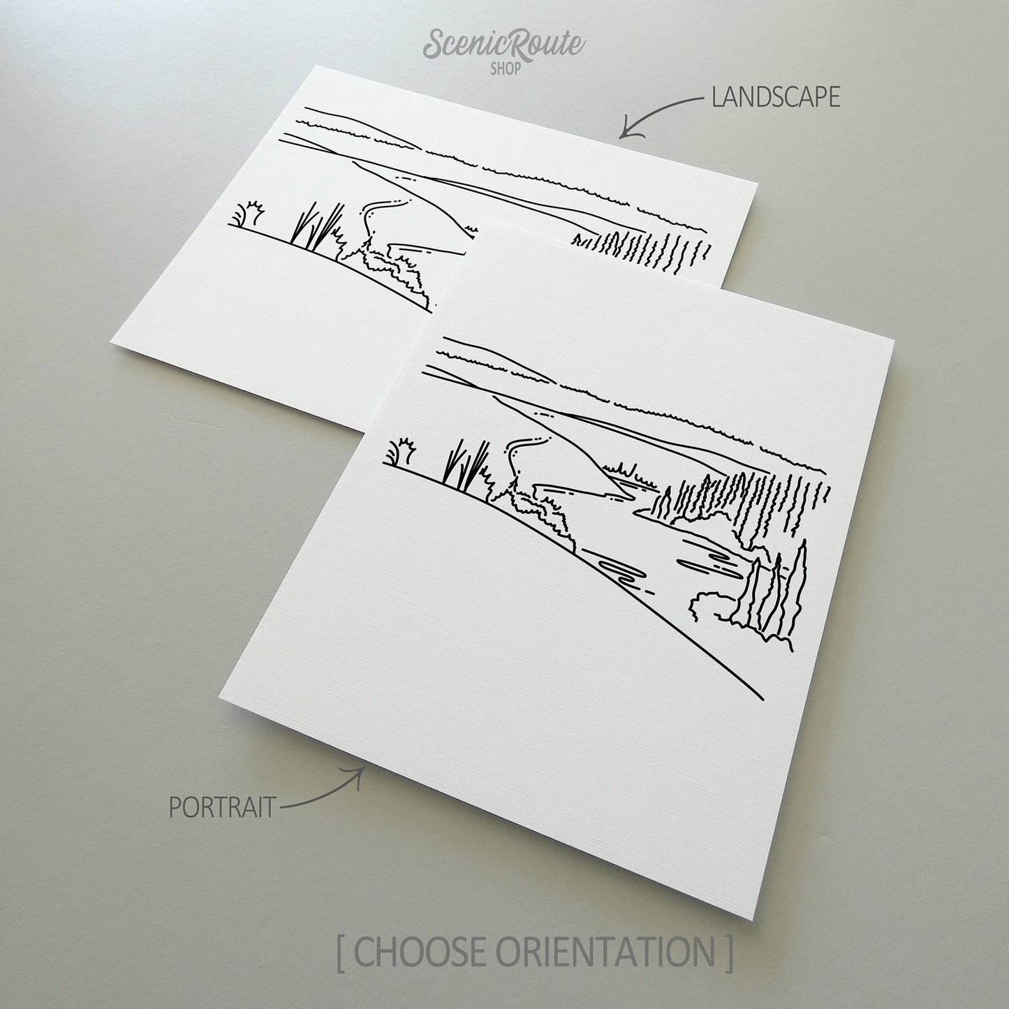 Two line art drawings of Kobuk Valley National Park on white linen paper with a gray background. The pieces are shown in portrait and landscape orientation for the available art print options.