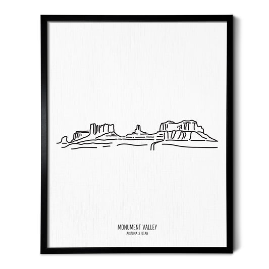 A line art drawing of Monument Valley Navajo Park on white linen paper in a thin black picture frame