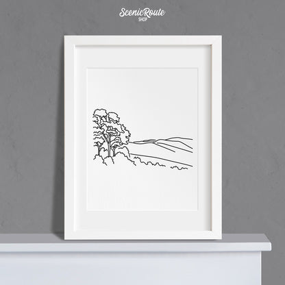 A framed line art drawing of Shenandoah National Park on a mantle