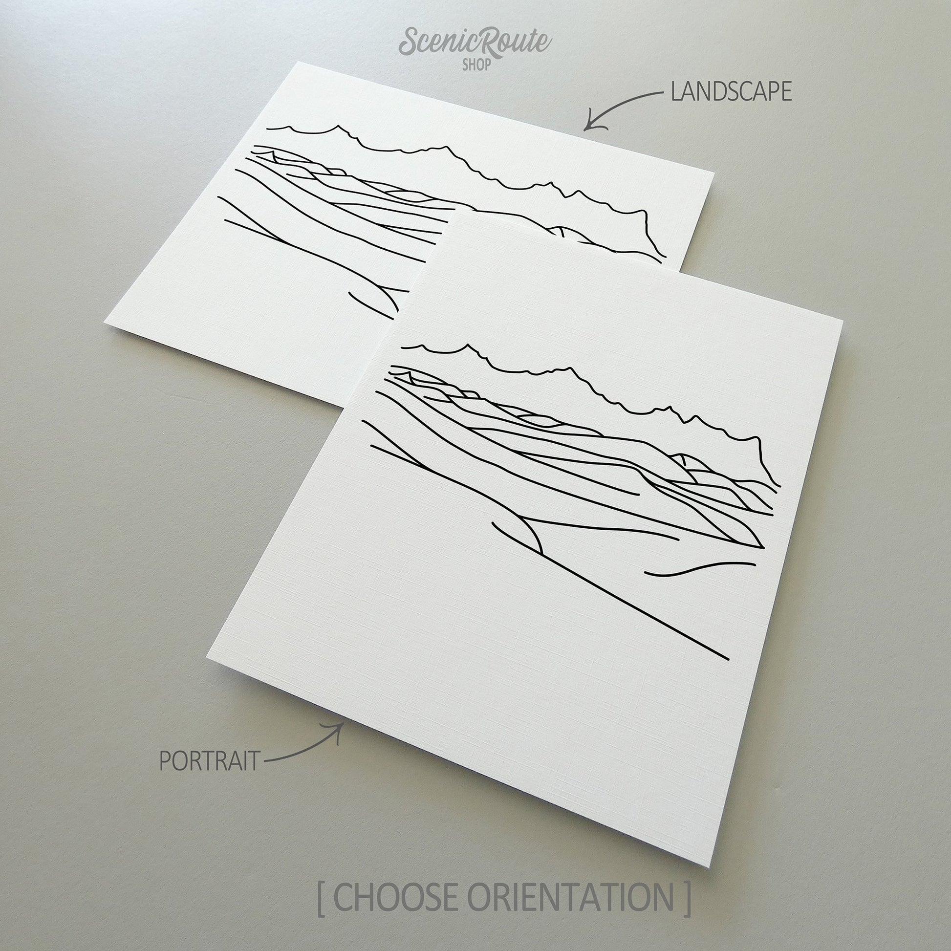 Two line art drawings of White Sands National Park on white linen paper with a gray background.  The pieces are shown in portrait and landscape orientation for the available art print options.
