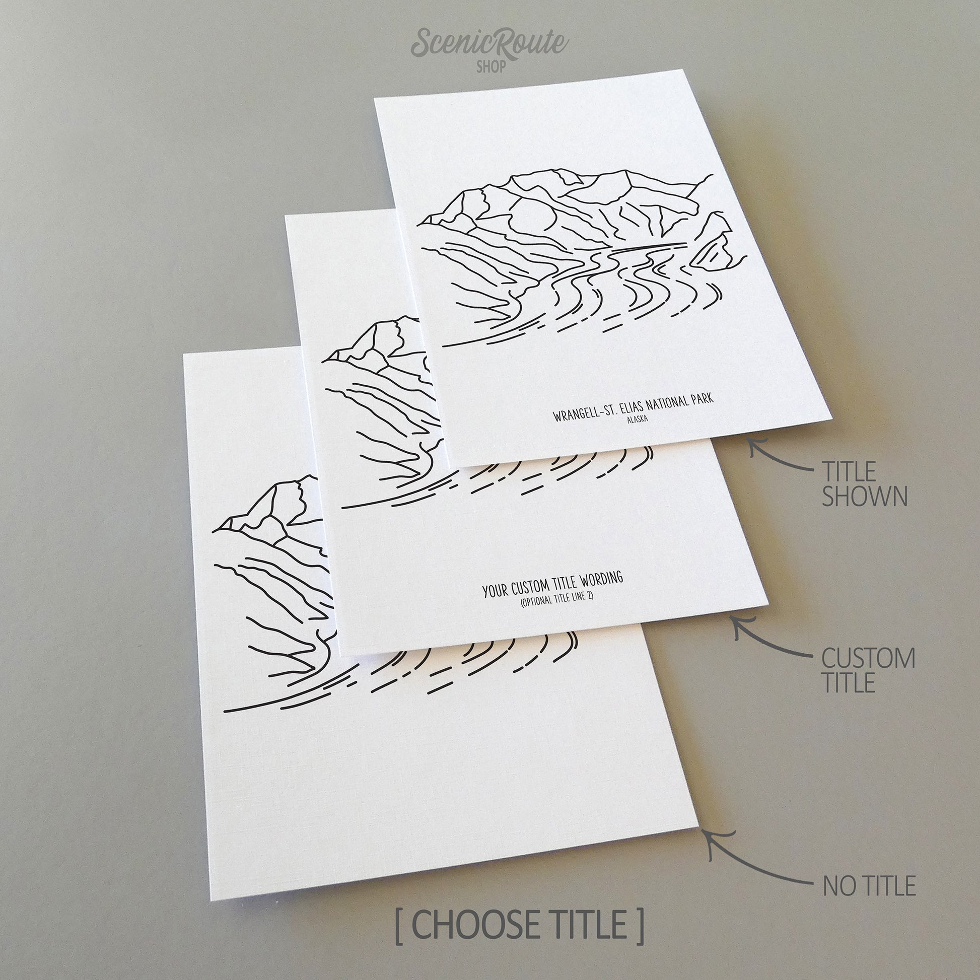 Three line art drawings of Wrangell Saint Elias National Park on white linen paper with a gray background. The pieces are shown with title options that can be chosen and personalized.