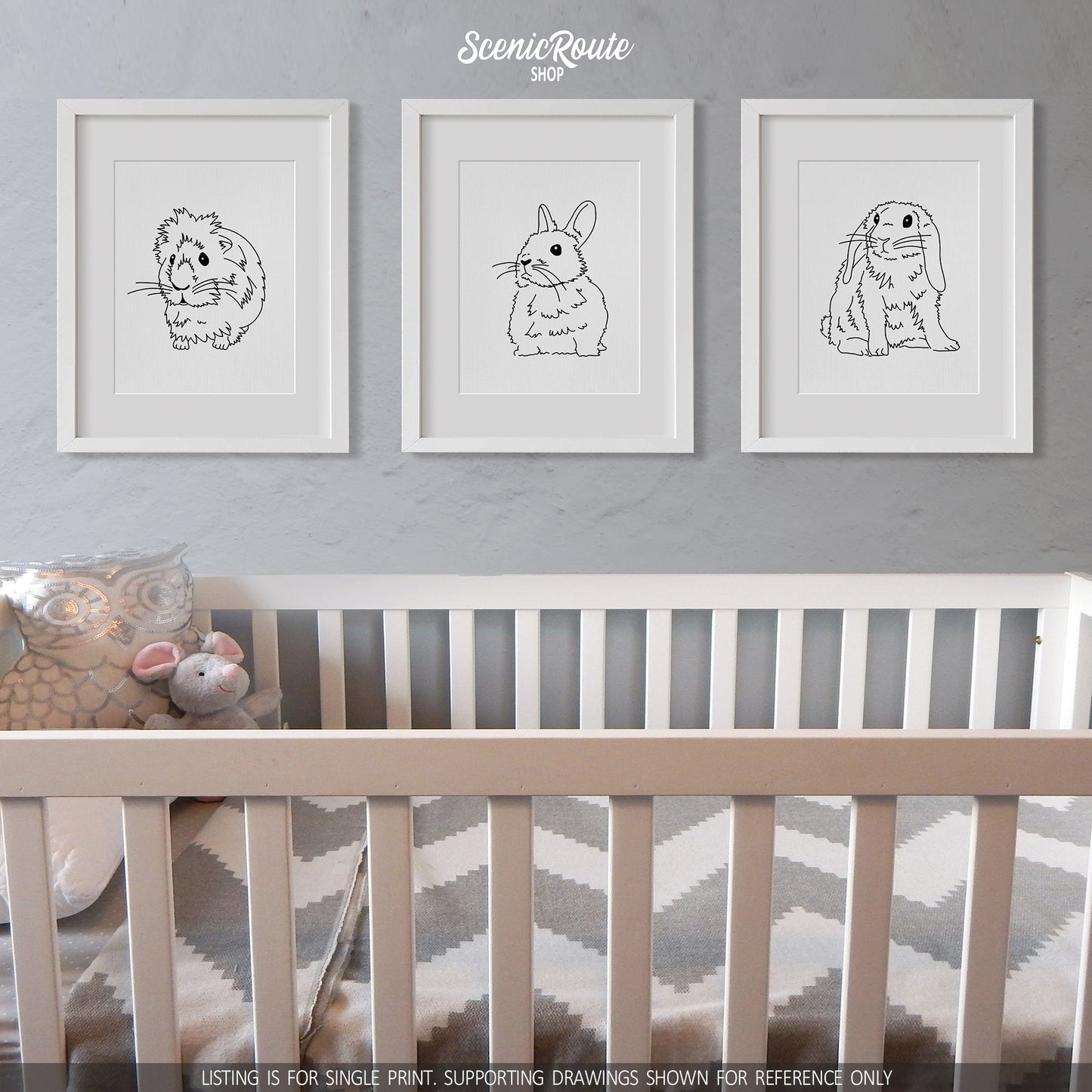A group of three framed drawings on a white wall above a crib. The line art drawings include a Guinea Pig, a Netherland Dwarf Rabbit, and a Mini Lop Rabbit