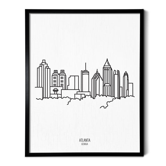 A line art drawing of the Atlanta Georgia Skyline on white linen paper in a thin black picture frame