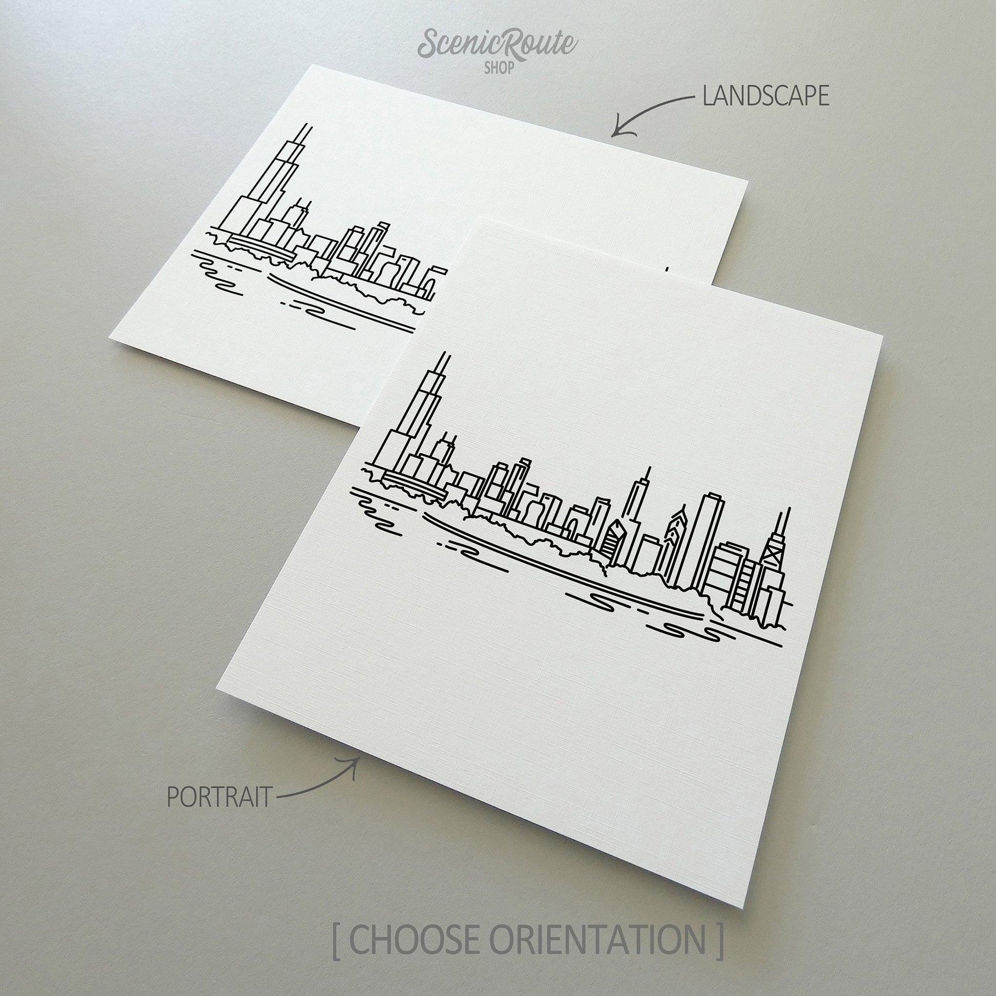 Two line art drawings of the Chicago Skyline on white linen paper with a gray background.  The pieces are shown in portrait and landscape orientation for the available art print options.