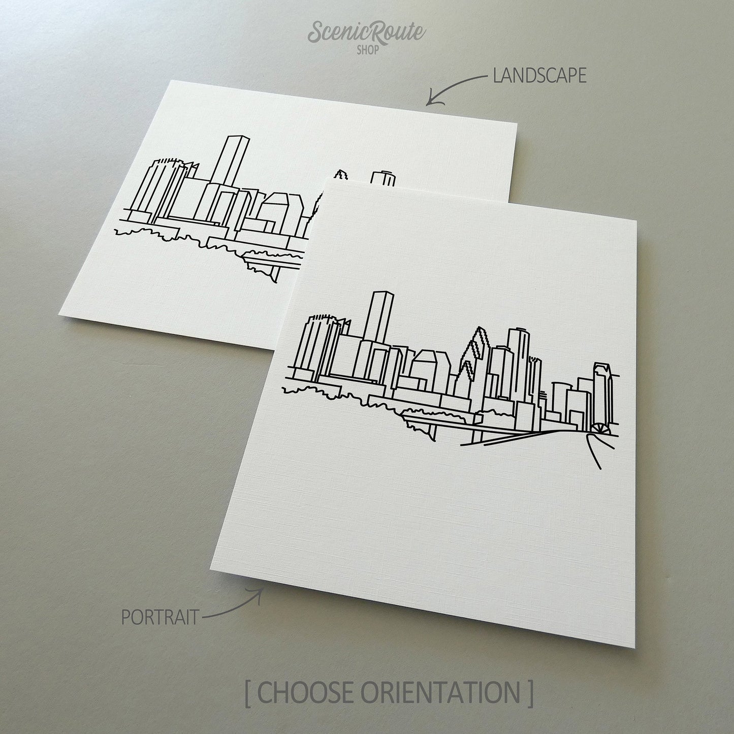 Two line art drawings of the Houston Skyline on white linen paper with a gray background.  The pieces are shown in portrait and landscape orientation for the available art print options.