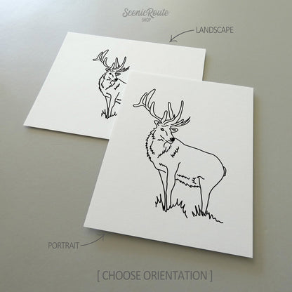 Two line art drawings of an Elk on white linen paper with a gray background.  The pieces are shown in portrait and landscape orientation for the available art print options.