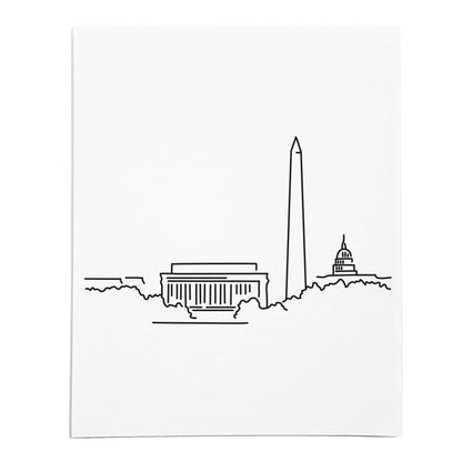 An art print featuring a line drawing of the Washington DC Skyline on white linen paper