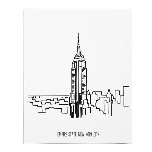 An art print featuring a line drawing of the Empire State Building on white linen paper