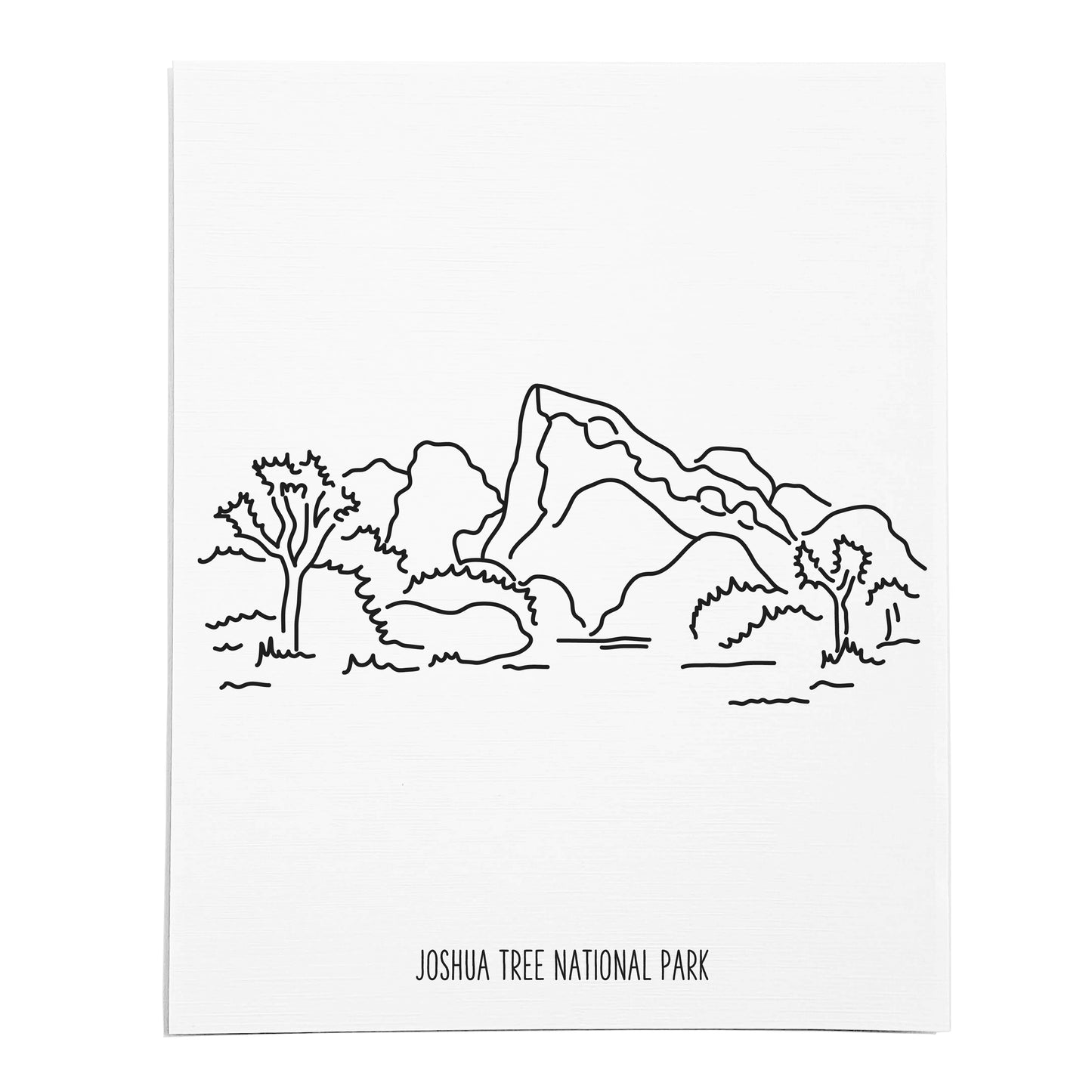 An art print featuring a line drawing of Joshua Tree National Park on white linen paper