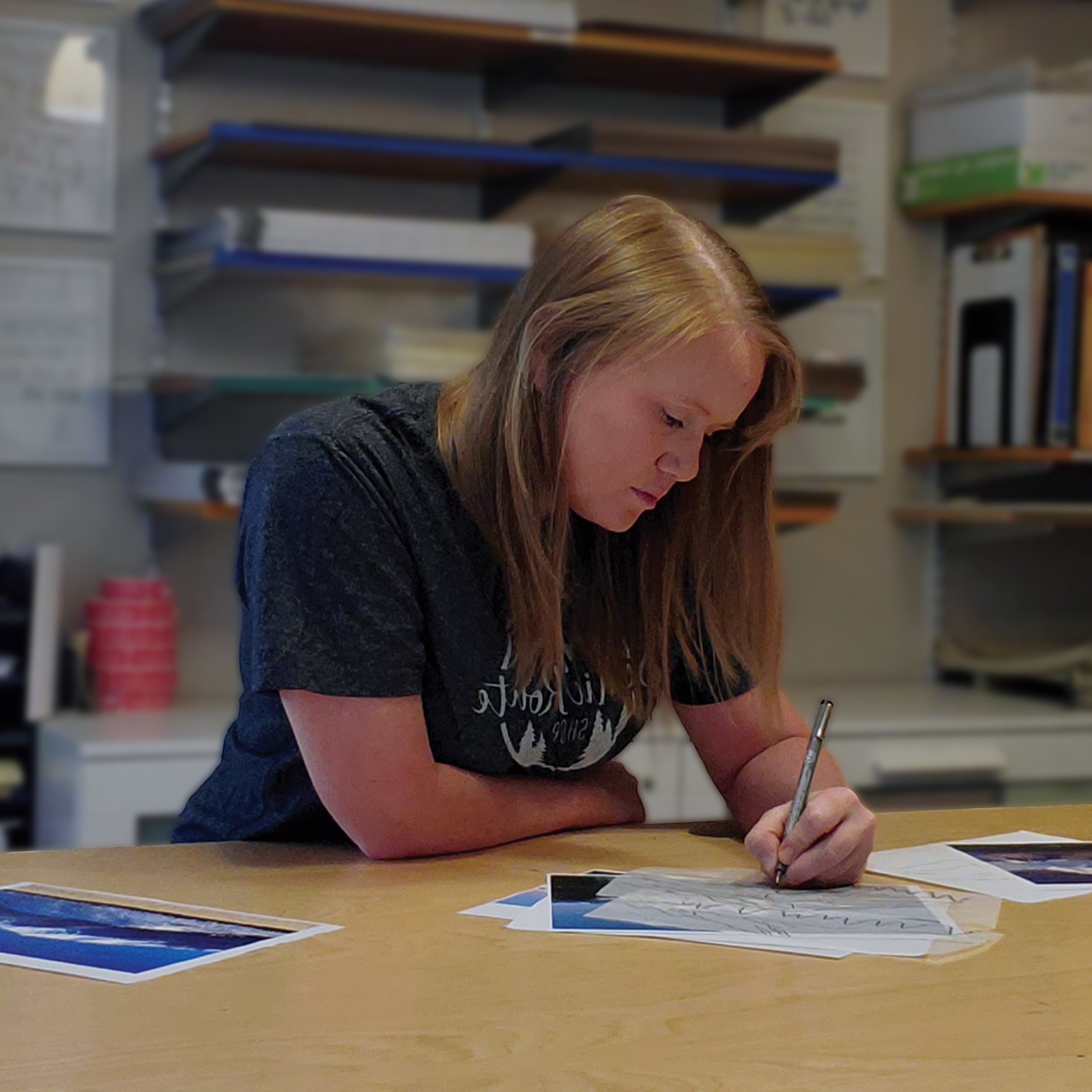 A photo of a woman drawing