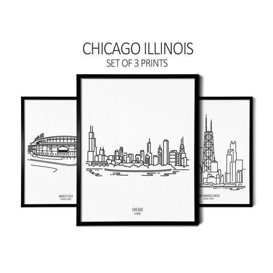 Custom line art drawings of Wrigley Field, the Chicago Skyline, and the John Hancock Tower on white linen paper in thin black picture frames