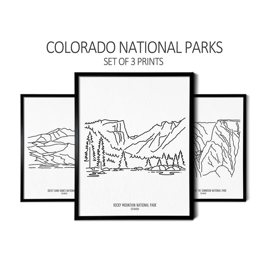 Custom line art drawings of Great Sand Dunes National Park, Rocky Mountain National Park, and Black Canyon of the Gunnison National Park on white linen paper in thin black picture frames
