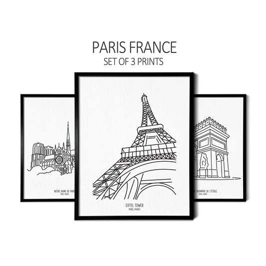 Custom line art drawings of Notre Dame Cathedral, Eiffel Tower, and Arc de Triomphe on white linen paper in thin black picture frames