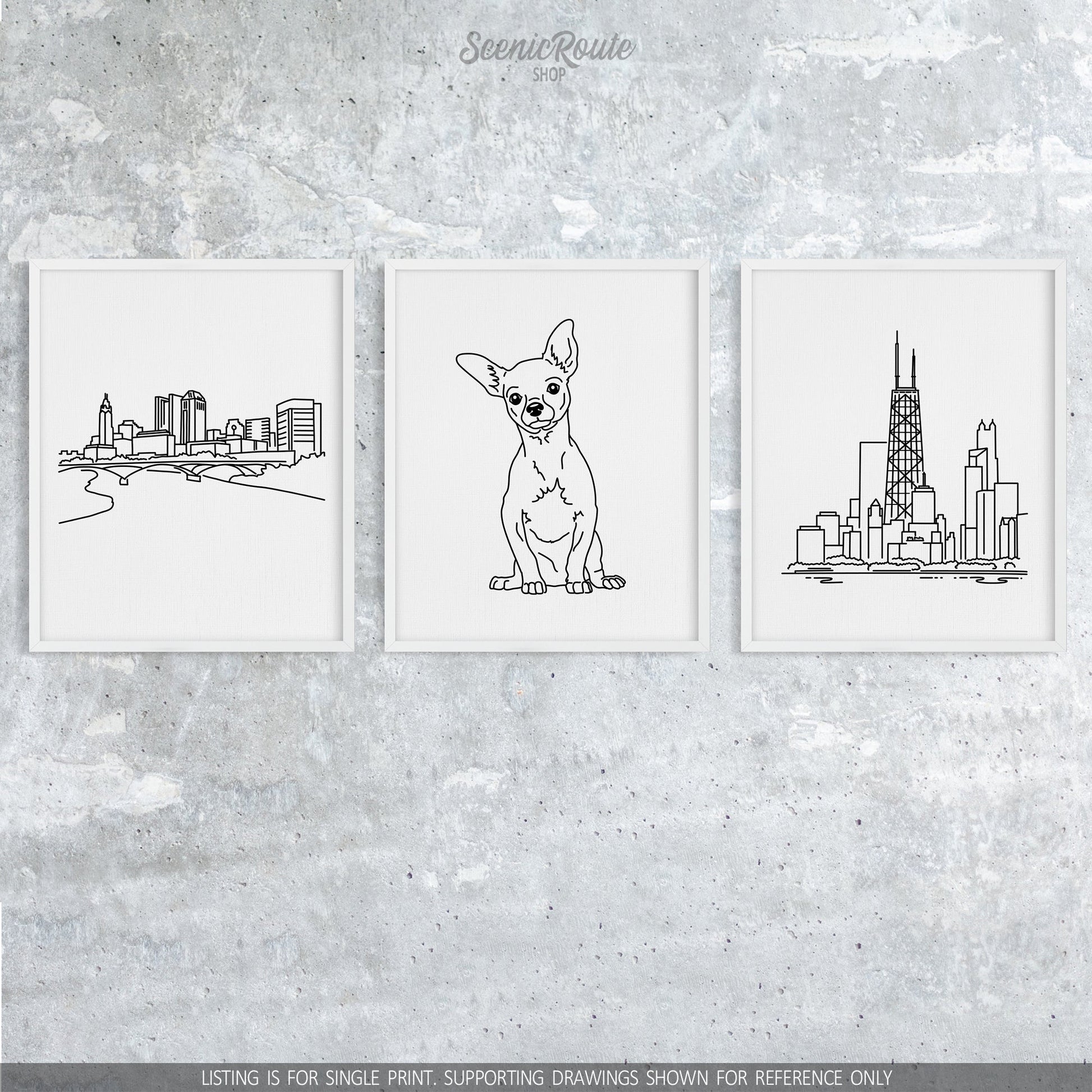 A group of three framed drawings on a concrete wall. The line art drawings include the Columbus Skyline, a Chihuahua dog, and the John Hancock Tower in Chicago